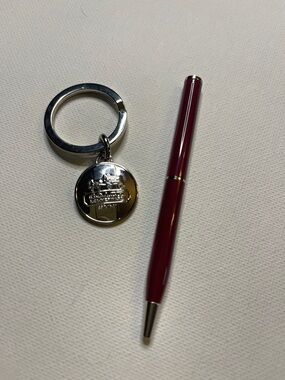 Coach Leatherware Silver Medallion Keychain with a Burgundy Coach Ballpoint Pen
